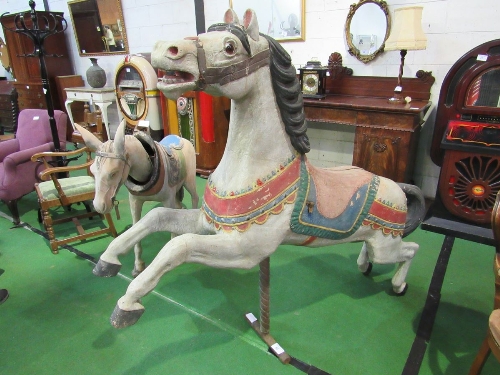 Hand-painted fibreglass carousel horse on original stand, length 183cms height 153cms. Estimate £