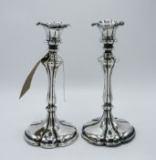 Art Nouveau pair of white metal candlesticks with worn out marks, complete with sconces