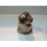 Paperweight pin cushion in the form of a deep sea diver's mask. Estimate £15-25