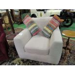 Fawn coloured upholstered armchair, 93 x 93 x 75cms. Estimate £20-30