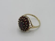 9ct gold red stone cluster ring, weight 3.8gms, size P