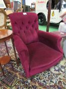 Red upholstered button-back armchair. Estimate £30-50