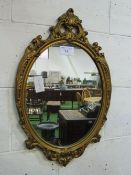 Decorative gilt framed wall mirror, 72 x 46cms. Estimate £10-20