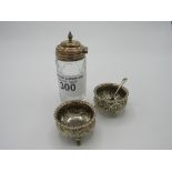 Sterling silver salt, pepper & mustard service. The 2 salts being decorated with chase & repousse