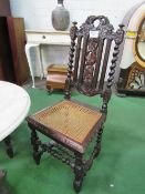 2 Edwardian carved oak cane seat high back chairs (1 a/f). Estimate £30-40