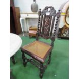 2 Edwardian carved oak cane seat high back chairs (1 a/f). Estimate £30-40