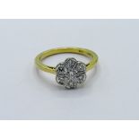 18ct gold floral set 7 diamond ring, weight 3.8gms, size O 1/2. Estimate £350-380