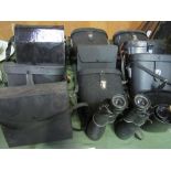 13 pairs of binoculars. Estimate £20-30