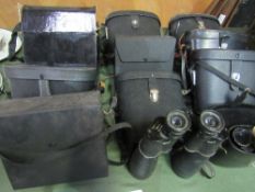 13 pairs of binoculars. Estimate £20-30