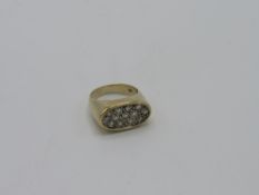 Large 9ct gold ring set with half a carat of diamonds, total weight 8.3gms. Estimate £300-350