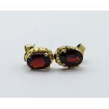 Yellow metal & garnet stud earrings with 9ct gold backs. Estimate £15-20
