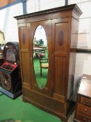 Edwardian mahogany wardrobe with oval door mirror & drawer to base, 116 x 45 x 204cms. Estimate £