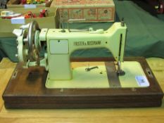 Frister & Rossman manual sewing machine, made in Western Germany, in wooden case. Estimate £20-30