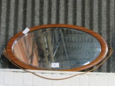 Mahogany framed oval bevel-edged wall mirror, 45 x 90cms. Estimate £10-20