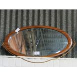 Mahogany framed oval bevel-edged wall mirror, 45 x 90cms. Estimate £10-20