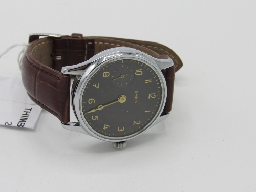 Vintage hand-winding wristwatch (converted from pocket watch) with glass back showing Omega