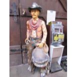 Fibreglass cowboy with saddle figure, height 183cms. Estimate £30-50