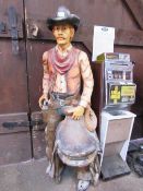 Fibreglass cowboy with saddle figure, height 183cms. Estimate £30-50