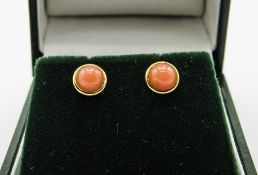 Yellow metal coral stud earrings with 9ct gold backs. Estimate £10-20