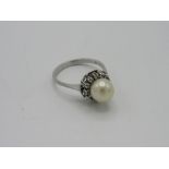 Edwardian 18ct white gold & platinum pearl & diamond daisy ring. Estimate £150-180