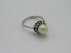 Edwardian 18ct white gold & platinum pearl & diamond daisy ring. Estimate £150-180