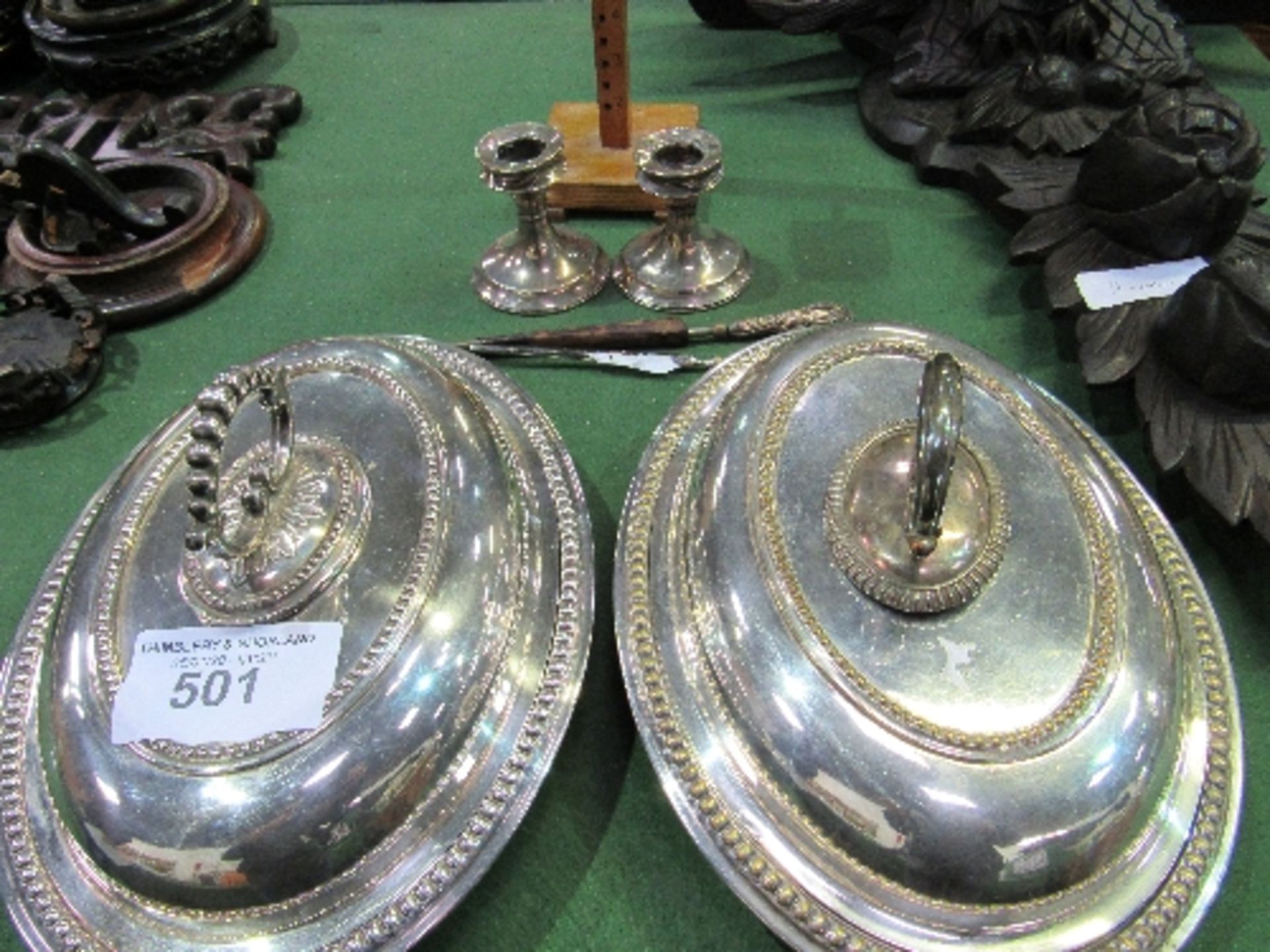 A pair of silver plated covered serving dishes; a pair of low silver candlesticks (a/f); silver - Image 2 of 2