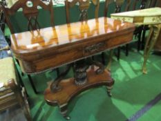 Mahogany inlaid fold-over top card table on single pedestal with scrolled supports to 4 legs on