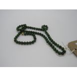 Wonderful necklace of deep green jade beads with an 18ct gold clasp, 18inchs & weight 72gms.