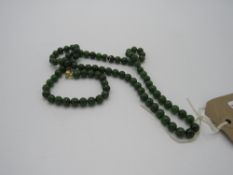 Wonderful necklace of deep green jade beads with an 18ct gold clasp, 18inchs & weight 72gms.