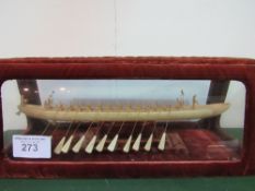 Carved bone model of an Egyptian rowing vessel in velvet & glass case. Estimate £50-100
