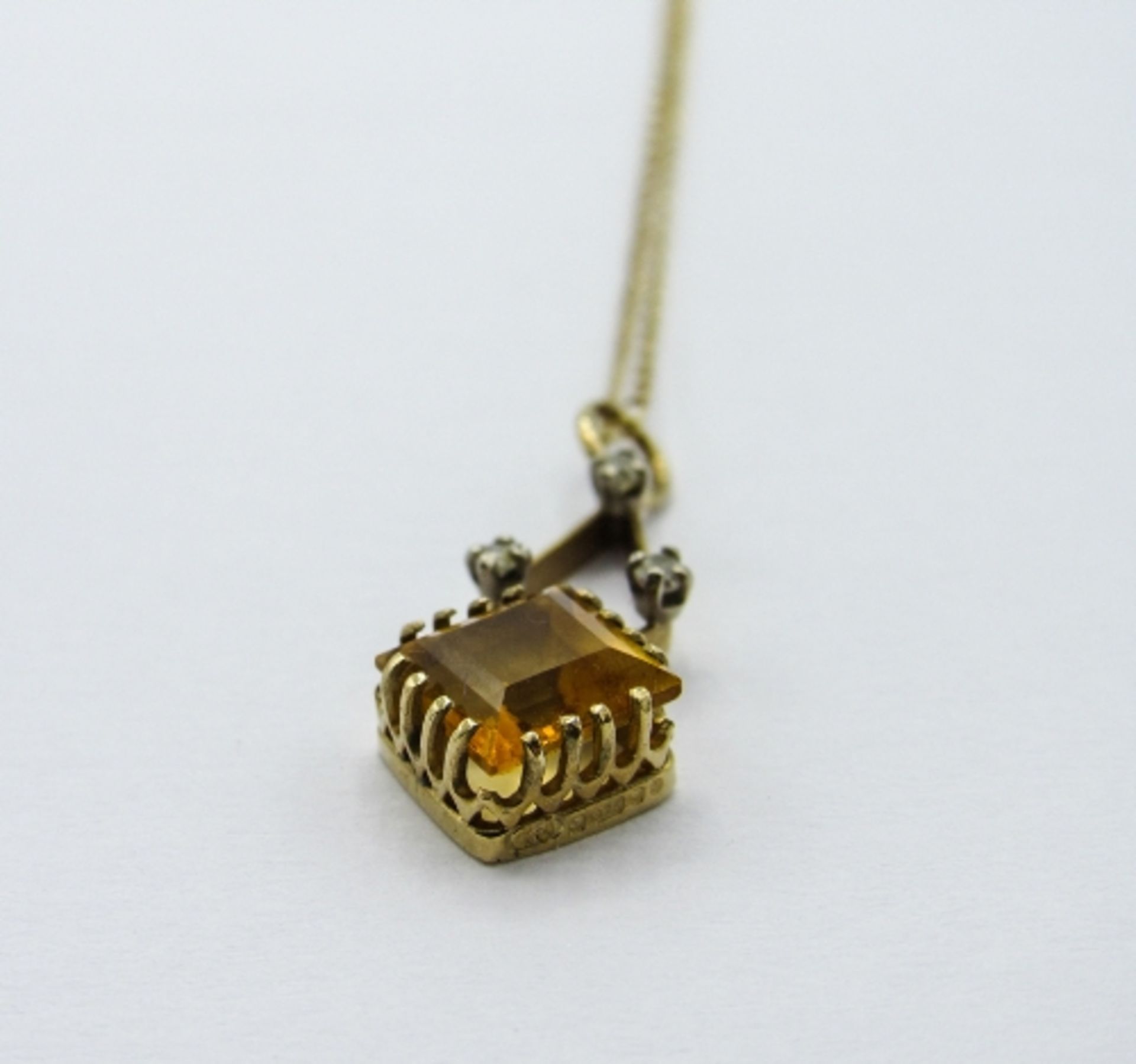 9ct gold & citrine pendant on a 9ct gold chain, weight 1.6gms, length 40cms. Estimate £20-30 - Image 2 of 3