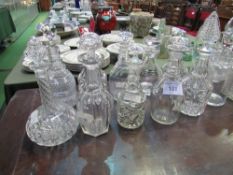 12 glass decanters, all with stoppers. Estimate £40-60