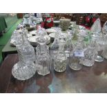 12 glass decanters, all with stoppers. Estimate £40-60