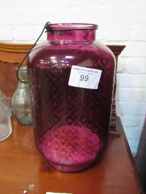 2 large purple glass candle holders. Estimate £20-30