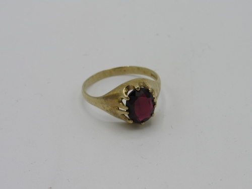 9ct gold ring with a red stone, weight 3.3gms, size U 1/2