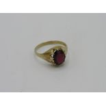 9ct gold ring with a red stone, weight 3.3gms, size U 1/2