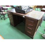 Oak twin pedestal desk with centre frieze drawers, 4 drawers to each pedestal, 140 x 79 x 80cms.