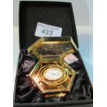 Jens Olsen gold plated travel clock in presentation box. Estimate £30-40