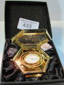 Jens Olsen gold plated travel clock in presentation box. Estimate £30-40