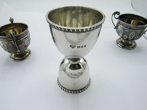 Silver hallmarked double ended egg cup, London 1904 & a pair of small silver double handled urns,