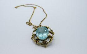 Aquamarine stone set in 9ct gold on a yellow metal chain, weight 6.4gms. Estimate £350-380