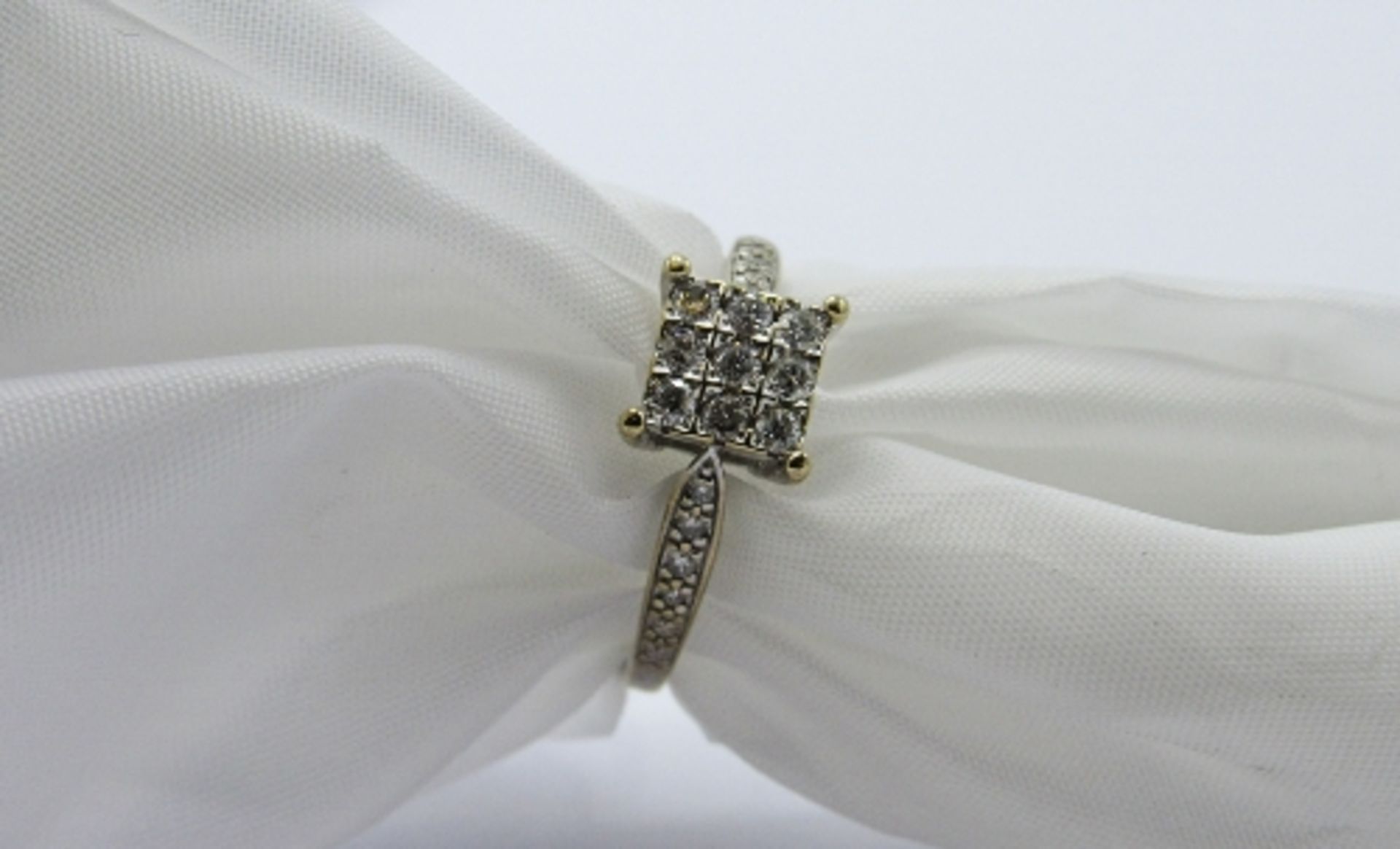 18ct white gold ring set with 9 diamonds in square with diamonds to shoulder, weight 3.8gms, size P.