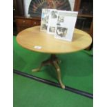 Circular hardwood tilt-top table on pedestal, 98cms diameter x 76cms. Estimate £20-40