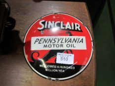 Circular Sinclair Pennsylvania motor oil enamel sign, 30cms diameter. Estimate £40-60