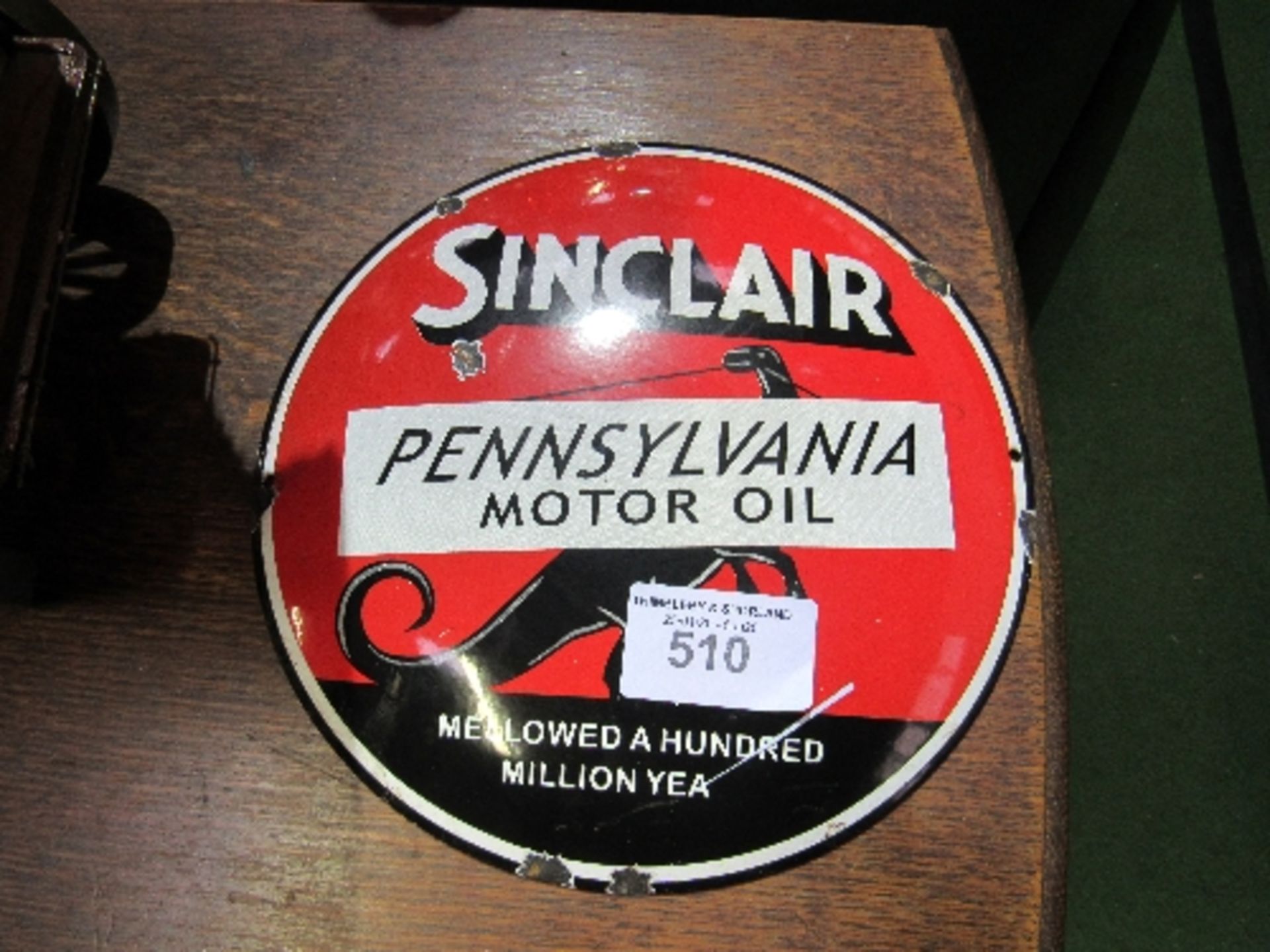 Circular Sinclair Pennsylvania motor oil enamel sign, 30cms diameter. Estimate £40-60