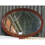 Mahogany framed oval bevel edge wall mirror, 61 x 85cms. Estimate £10-20