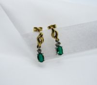 Pair of green stone earrings. Estimate £50-60