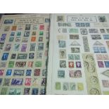 A box of Carters Seeds office display of approx. 14,000 World used postage stamps stuck