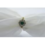 18ct gold cluster ring with centre emerald surrounded by diamonds, weight 3.8gms, size P.