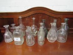 14 various Victorian moulded & crystal glass decanters, without stoppers. Estimate £20-30